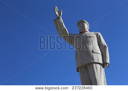 Image Of Statue Of Chairman Mao Zedong Against A Blue Sky In Lijiang, China Captured On November 28,