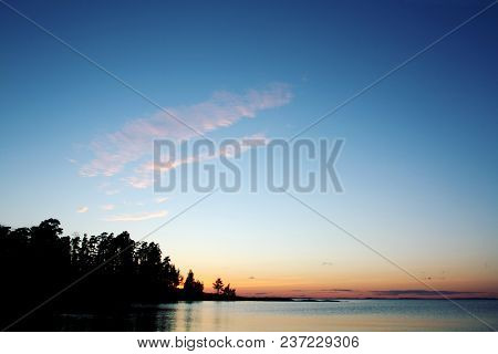 Beautiful Sunset At Ladoga Lake. Copy Space. Aged Photo In Retro Style. Wild Nature Of Russian North