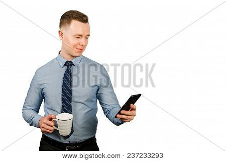 Young Businessman Dressed In Blue Shirt And Tie, Isolated On White Background