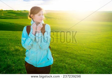 Young Woman Hiking In Beautiful Nature. Sports And Healthy Lifestyle Concept.