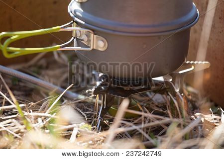 A Closeup Of A Boiling Pot On A Gas Primus Cooking Dinner For Hikers. Outdoors Kitchen.