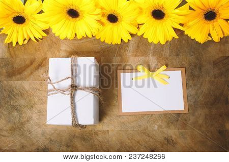 Little Gift Box With With Yellow Flowers In A Rustic Style