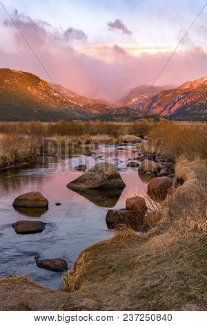 Spring Storms Over The Continental Divide With A Glowing Big Thompson River Flowing At Sunrise