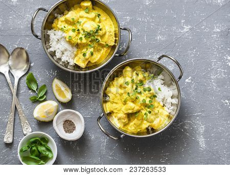 Salmon Curry And Rice In Curry Dishes On Grey Background, Top View. Indian Cusine Style. Flat Lay