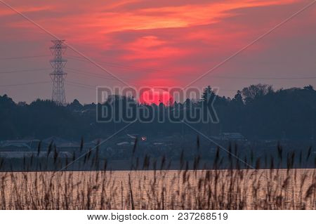 The Sun Settles Beneath The Hills During A Late March Sunset Over Lake Inba-numa In Chiba Prefecture