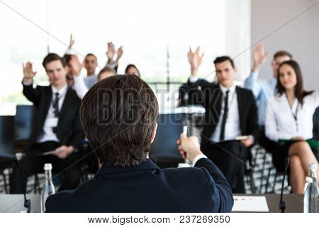Speaker At Business Conference And Audience Asking Questions