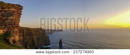 Beautiful Scenic Aerial Drone View Of Ireland Cliffs Of Moher In County Clare. Sunset Over The Cliff
