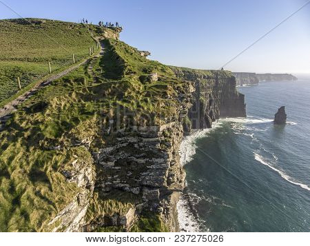 Beautiful Scenic Aerial Drone View Of Ireland Cliffs Of Moher In County Clare. Sunset Over The Cliff