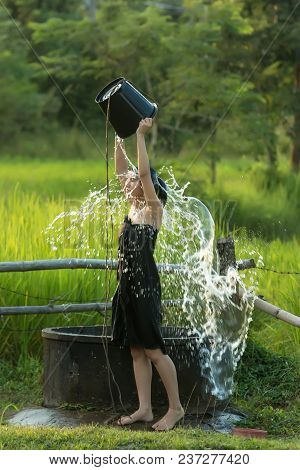 Asian Sexy Woman Bathing In Farmland At Location Countryside Of Thailand