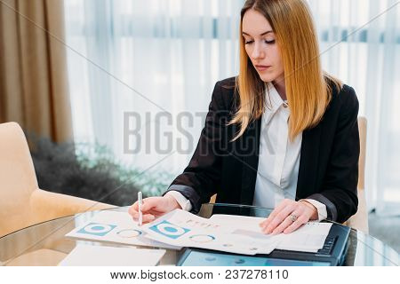 Business Lady At Work. Company Manager. Woman Looking Through Documents In Office. Professional Corp