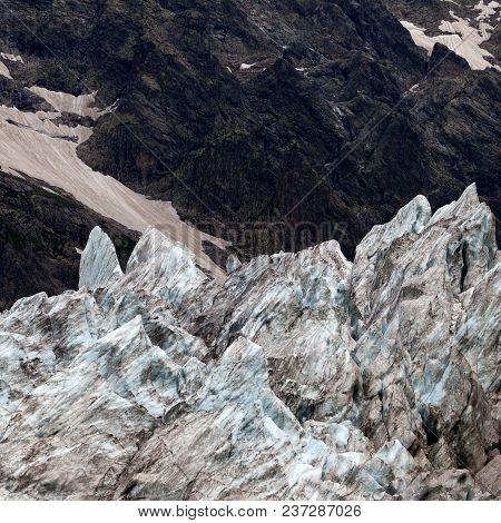 Glacier In Summer Mountains. Caucasus Mountains, Georgia, Region Svaneti.