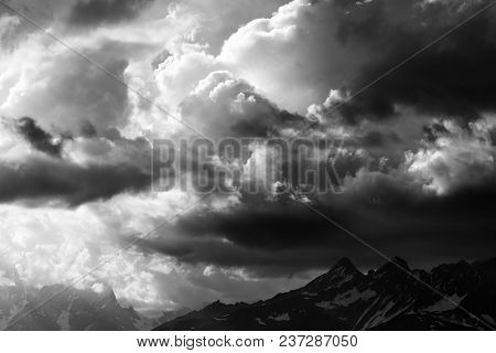 Black And White View On Summer High Mountains And Sunlight Storm Clouds. Caucasus Mountains. Georgia