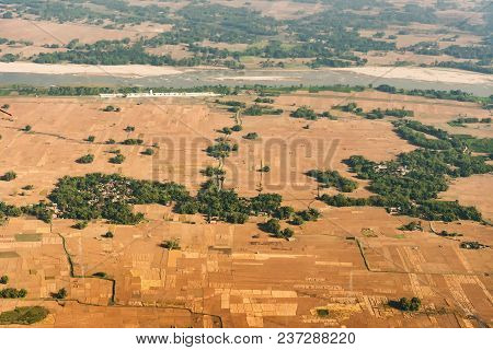 Aerial View Of Bangladesh Agricultural Field - View Of Paddyfield From Sky. Bangladesh Is A Agricult