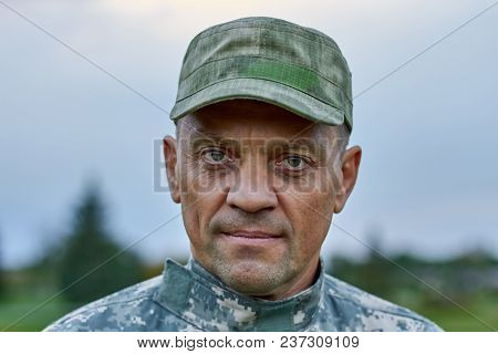 Portrait Of Serious Soldier Face, Close Up. Mature Brave Strong Earnest Soldier Outdoor.