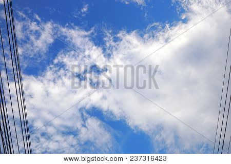 Beautiful Nature Blue Sky With Clouds And Cable, Sky Clouds Background, Cloudscape Concept. Space Fo