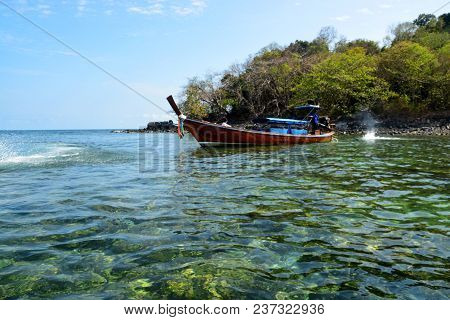 Koh Hin Ngam  Is A Unique Small Island Unlike Other Island. It's Covered With Small Black Rocks
