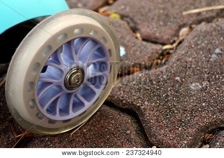 Closeup Of Scooter Wheel On The Street