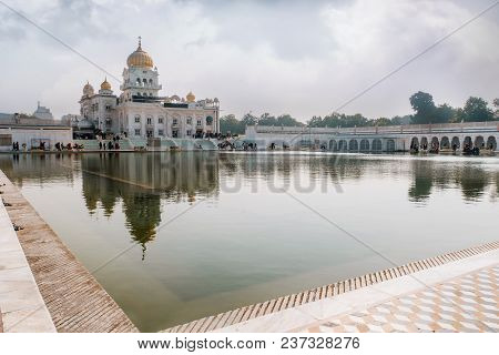 Gurdwara Bangla Sahib Is The Most Prominent Sikh Gurdwara. A Large Pond In Front Of The Temple