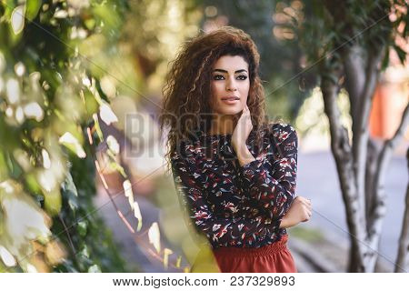 Beautiful Young Arabic Woman With Black Curly Hairstyle.