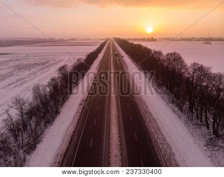 Beautiful Sunrise Aerial View Above Highway. Car Travel Concept