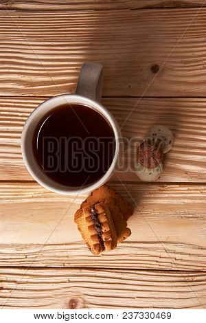 Cup Of Tea With Tasty Cookies On Wooden Background