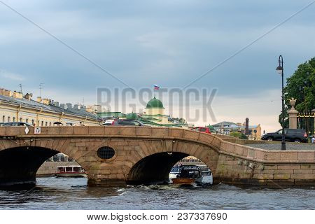 Russia, Saint Petersburg - August 18, 2017: Pleasure Boat Comes From The River Neva Under The Prache