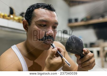 Ubud, Indonesia - August 8, 2016: Unidentified balinese artists preparing for traditional Kecak Fire Dance ceremony in Hindu temple on Bali, Indonesia