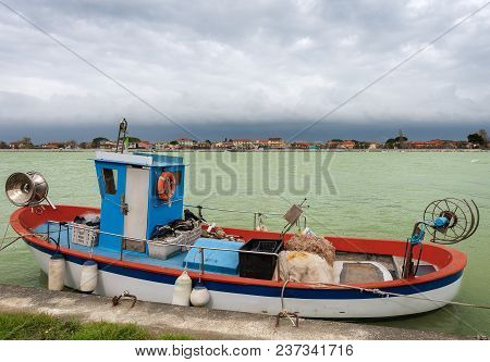 Small Fishing Boat Moored On The Bank Of The River Magra. Bocca Di Magra, Tuscany And Liguria, Italy