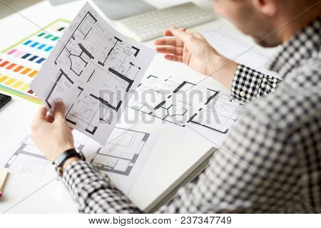 Close-up Shot Of Confident Interior Designer Studying Floor Plan While Thinking Over New Project, Of