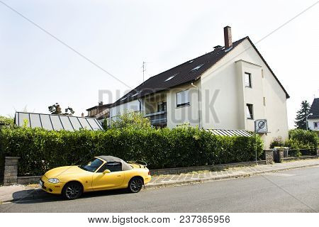 German People Stopping Yellow Sport Car At Beside Road On Ilvesheimer Road At Mannheim City