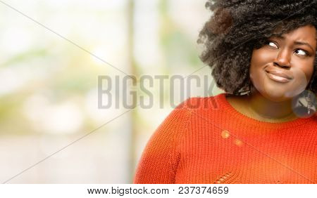 Beautiful african woman making funny face fooling, outdoor