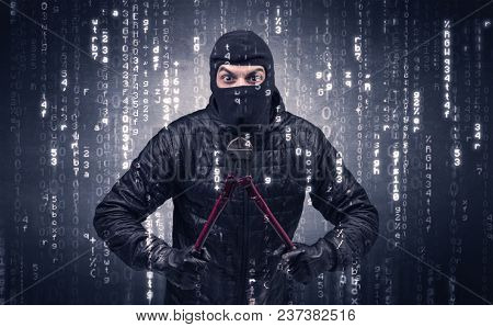 Burglar in action with encoded concept and his tools in his hand. 