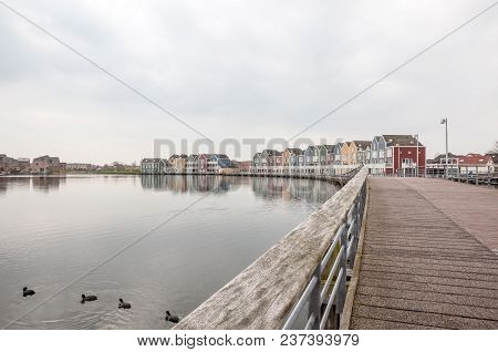 In The Town Of Houten, These Beautifully Painted Houses Are On The Water