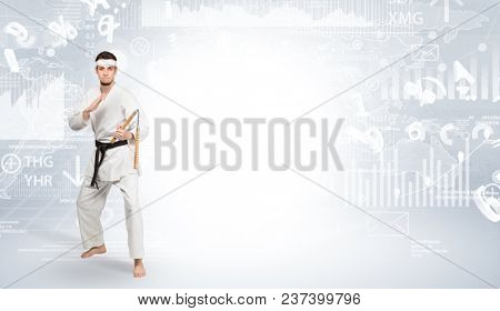 Young karate trainer doing karate tricks on the top of a metropolitan city