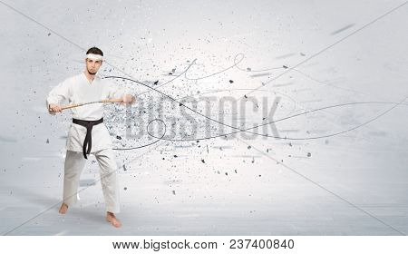 Young karate trainer doing karate tricks with chaotic concept