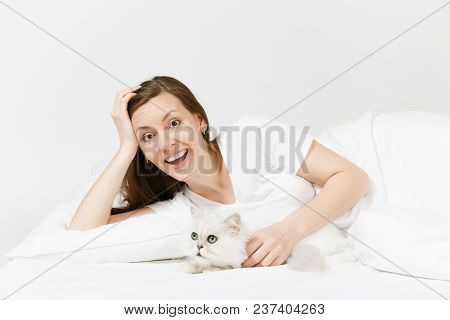 Calm Young Woman Lying In Bed With White Cute Persian Silver Chinchilla Cat, Sheet, Pillow, Blanket