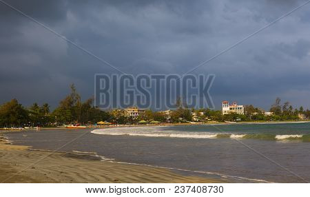 Seashore Landscape. Fishing Boats In Sri Lanka During Sea Storm Under Heavy Clouds As Seen From The 