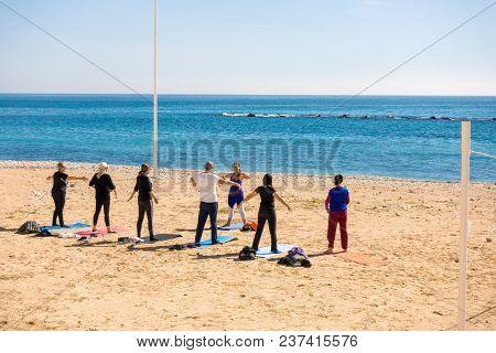 Altea, Spain - March 9 2018: Active People Doing Exercises On The Beach In Altea, Spain.