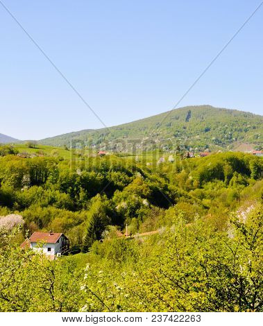 Picture Is Showing A House Beneathe The Mountain