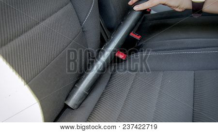 Closeup Photo Of Female Hand Holding Vacuum Cleaner Tube Clening Car Seats