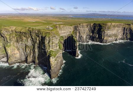 Beautiful Scenic Aerial Drone View Of Ireland Cliffs Of Moher In County Clare. Sunset Over The Cliff