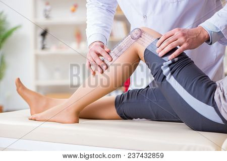 Doctor checking patients joint flexibility