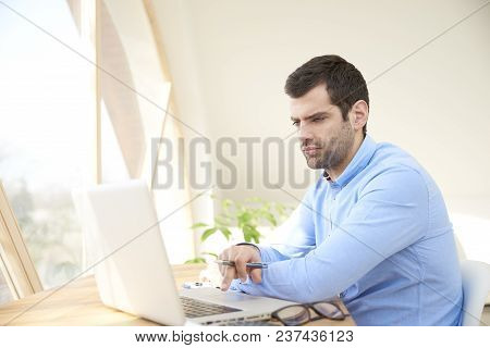 Young Businessman Working On Laptop