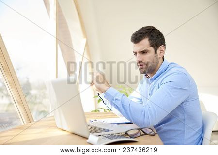 Young Businessman Working On Laptop