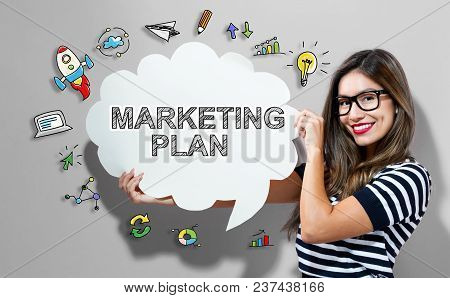 Marketing Plan Text With Young Woman Holding A Speech Bubble
