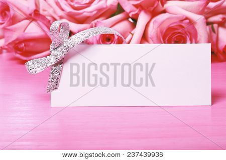 Pink Roses With A Message Card On A Bright Pink Background