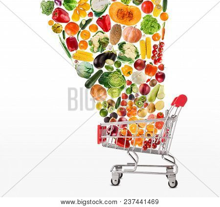 Grocery Cart With Vegetables And Fruits Falling In It Isolated On White. Healthy Meals Shopping, Cor