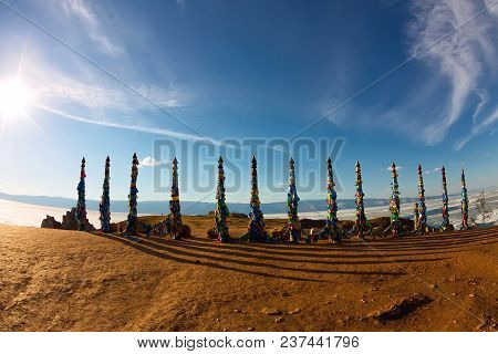 Shaman Poles Of Serge On Olkhon In The Sunset With Long Shadows