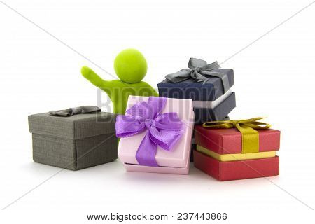 Lime Green Plasticine Character And Gift Boxes On White Background. Present Boxes. Holidays Concept.