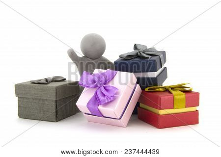 Gray Plasticine Character And Gift Boxes On White Background. Present Boxes. Holidays Concept.
